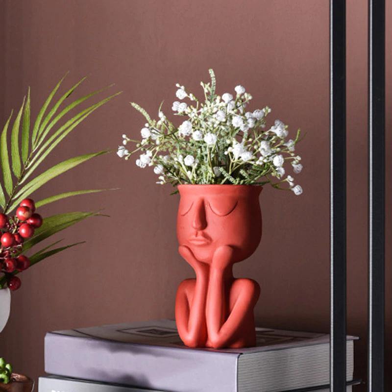 Cache-pot en céramique en forme de visage au repos