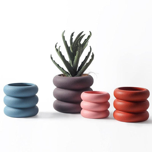 Pot de fleurs en céramique à roulettes rondes